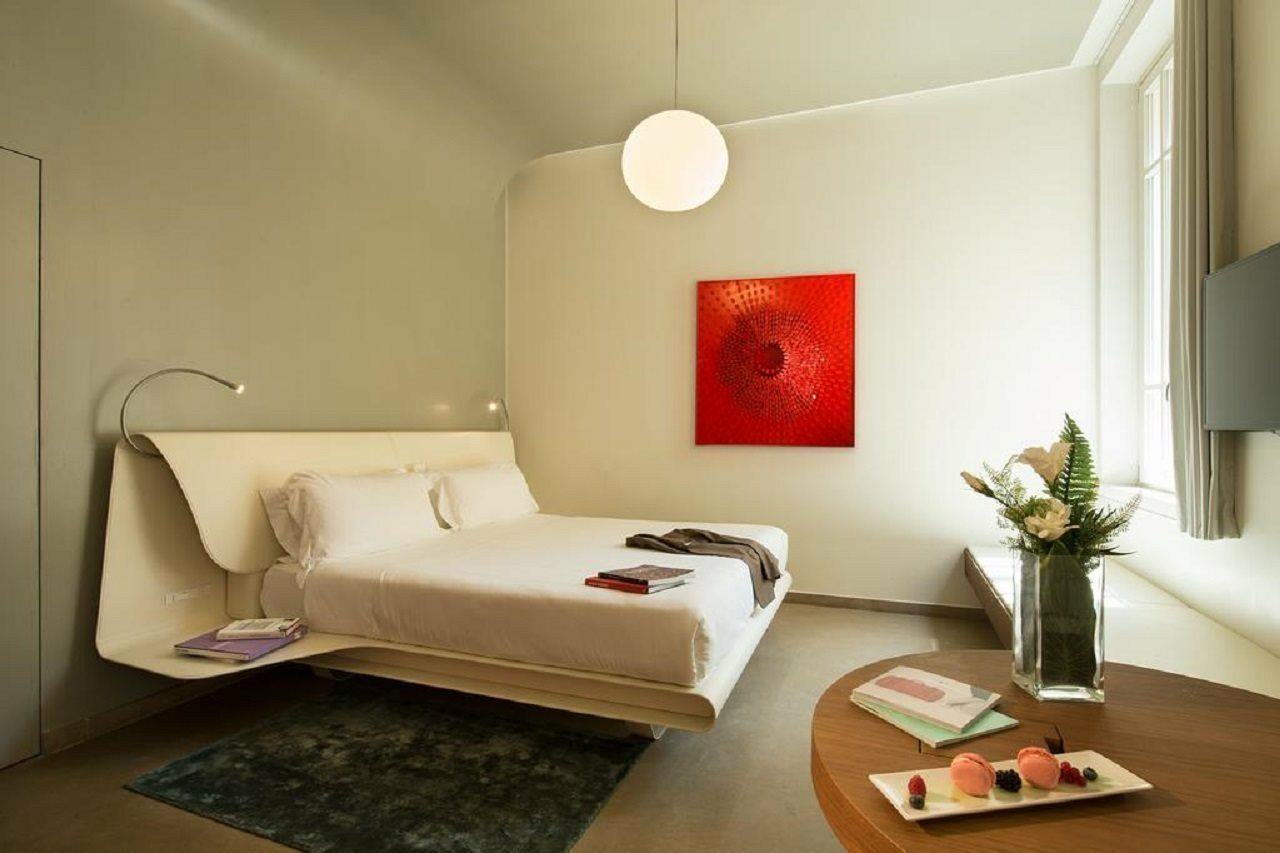 팔라초 몬테마르티니 롬, 어 래디슨 컬렉션 호텔 로마 외부 사진 A room at the hotel